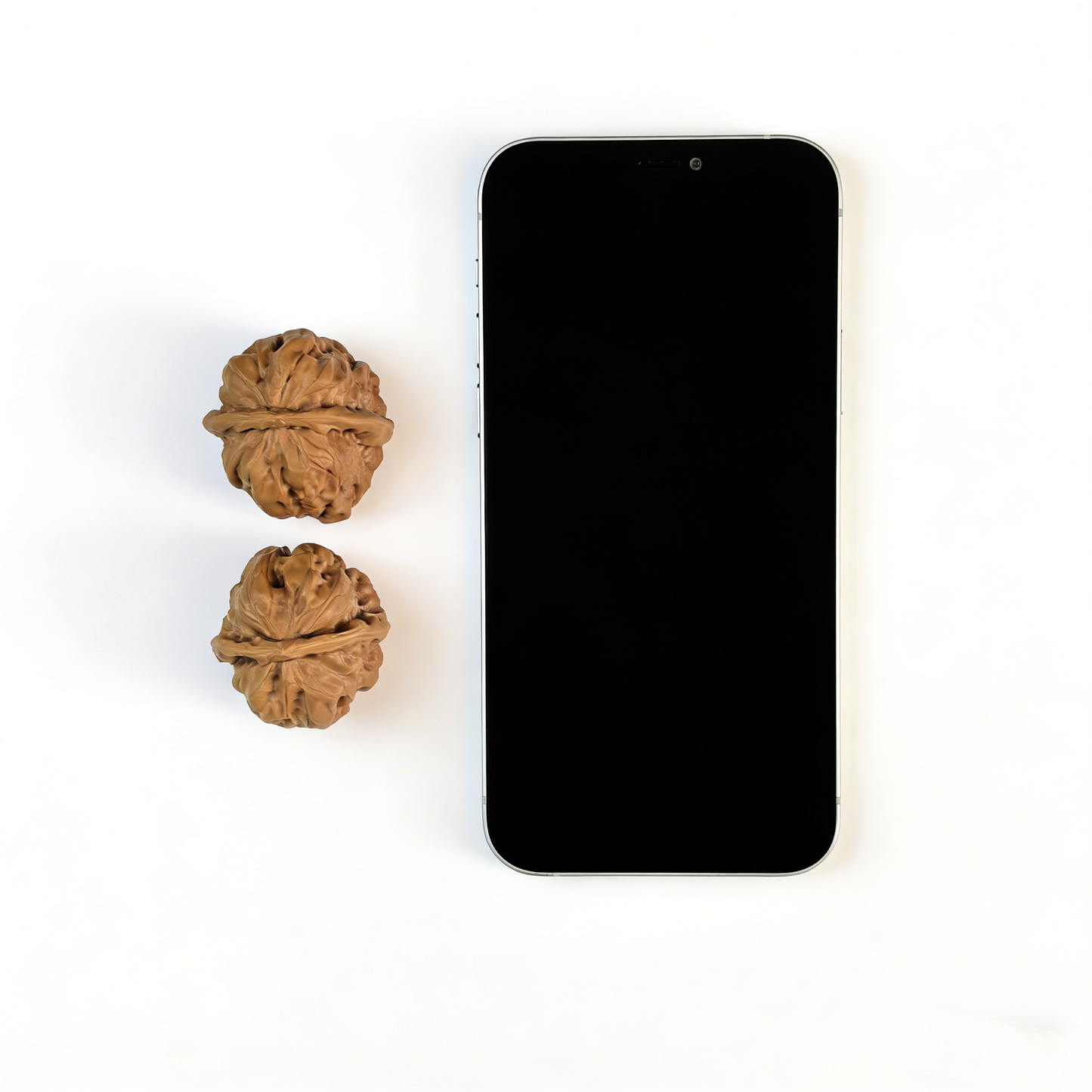 Pair of walnut hand exercisers with flat-base silhouette and earthy textured surface, 35mm size, from ThePatinaProject.