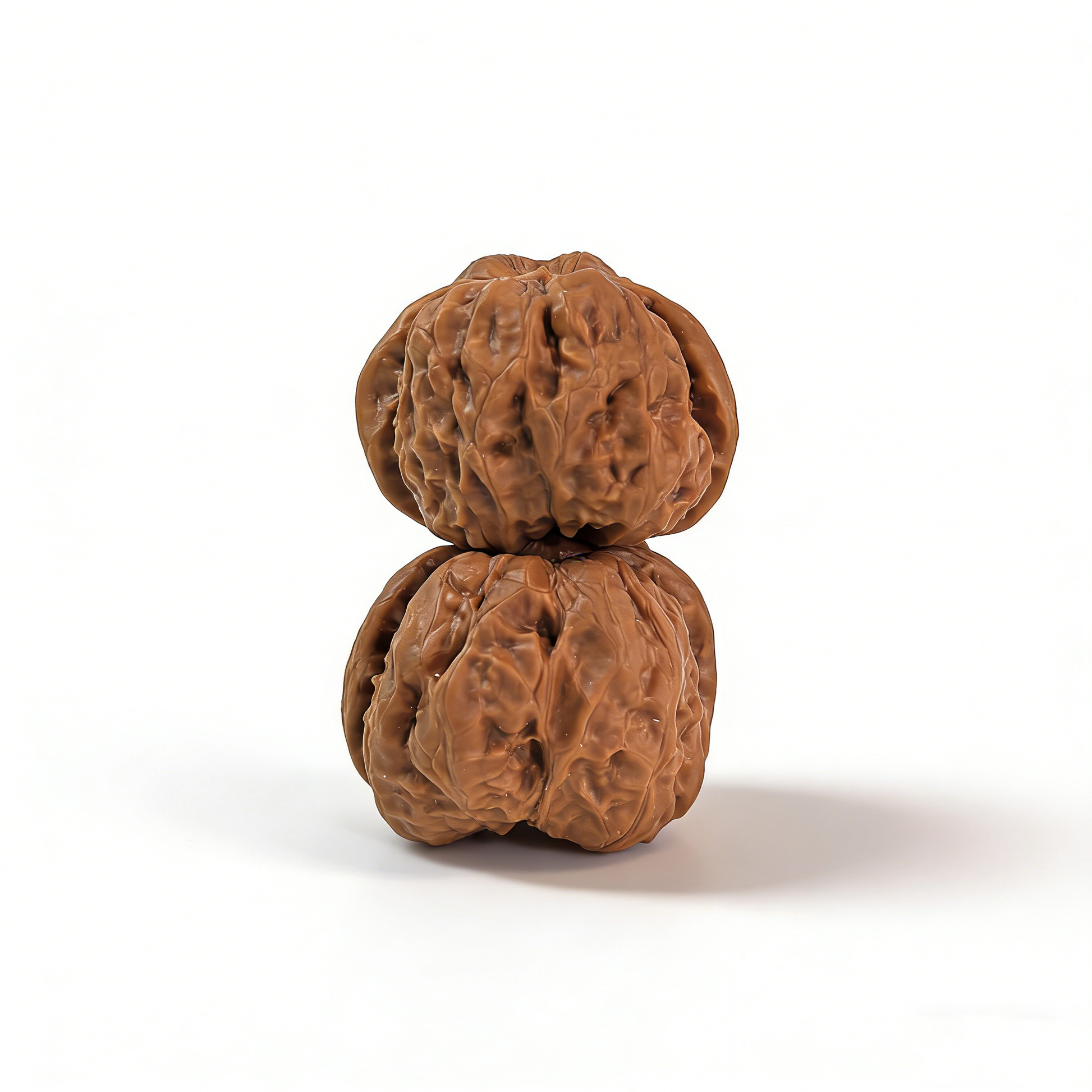 Pair of walnut hand exercisers featuring rugged ancient texture and flat-base silhouette, 39mm size by ThePatinaProject.