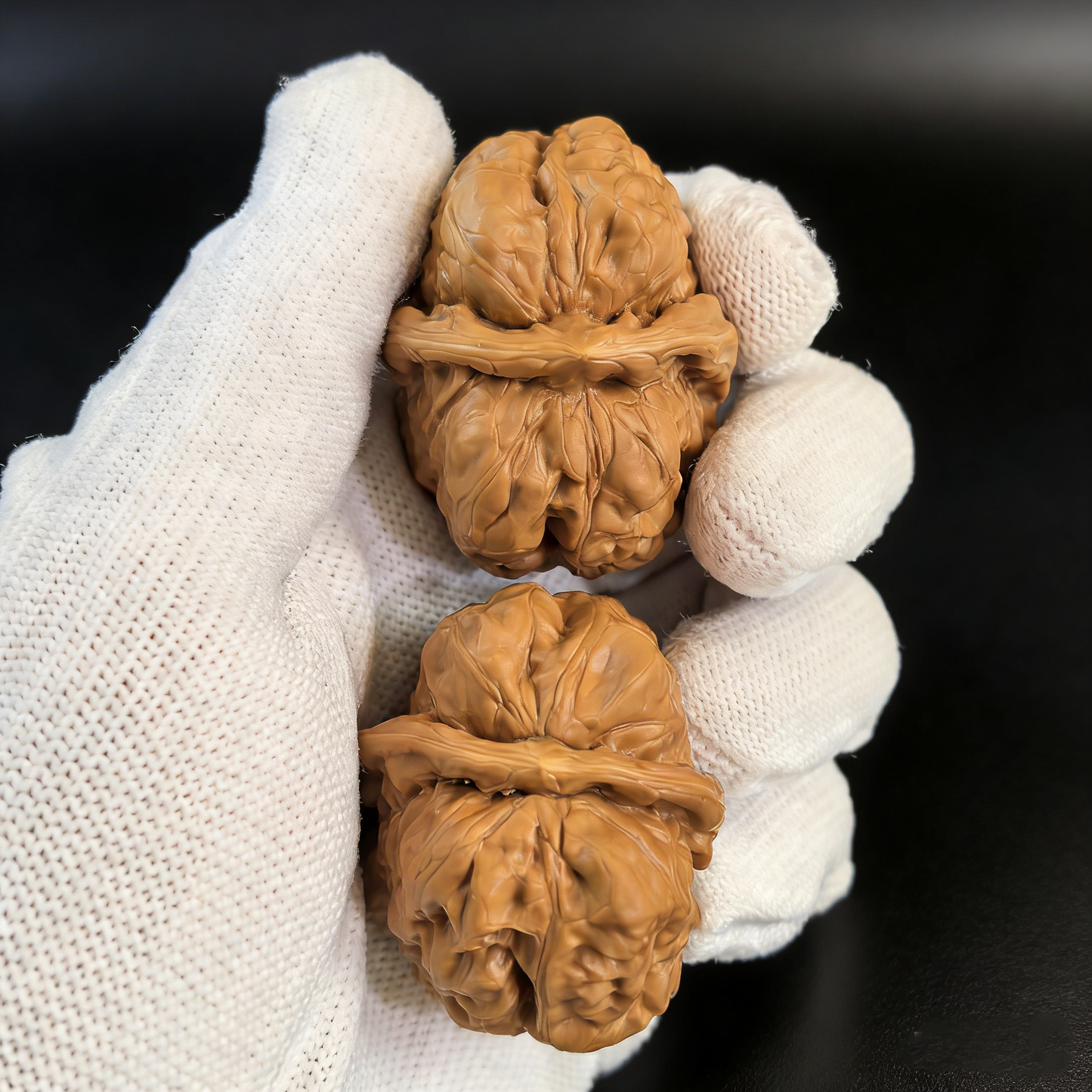 Walnut hand exercisers from ThePatinaProject, "Toad Head" textured skin architecture, 35mm collector’s pair for hand strength training.