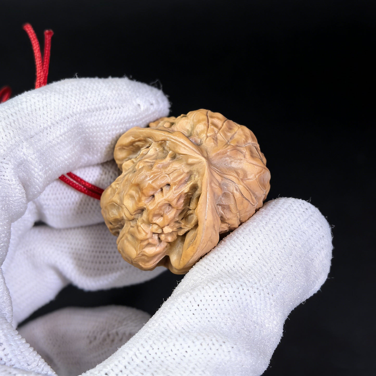Walnut hand exerciser pendant featuring a natural sculptural toad head design by ThePatinaProject, 32mm handcrafted accessory.