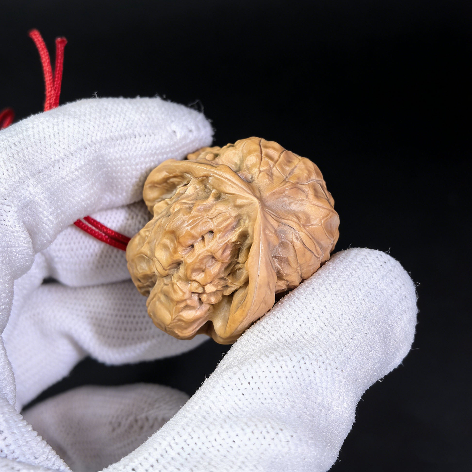Walnut hand exerciser pendant featuring a natural sculptural toad head design by ThePatinaProject, 32mm handcrafted accessory.
