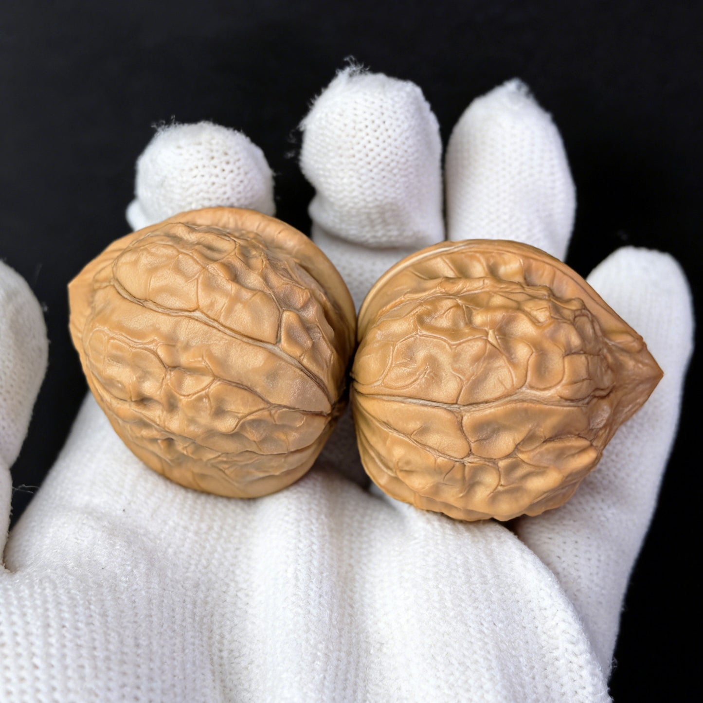 Pair of walnut hand exercisers with tortoiseshell pattern, 33mm by 38mm, by ThePatinaProject, designed for grip and hand strength.