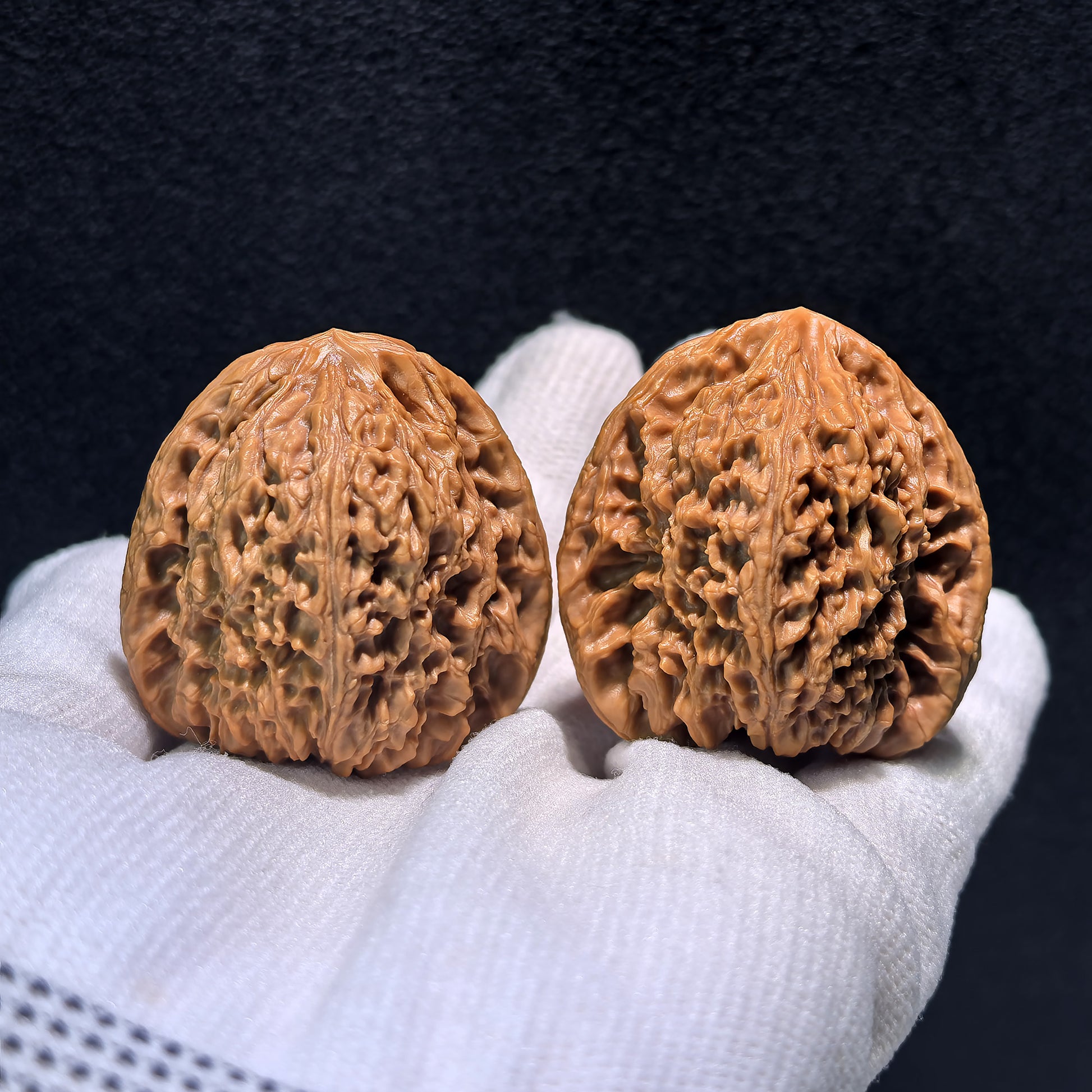 Pair of Walnut Hand Exercisers, Triangle Nan Jiang Shi, 39mm x 37mm, by ThePatinaProject, showing smooth, polished wooden surfaces.