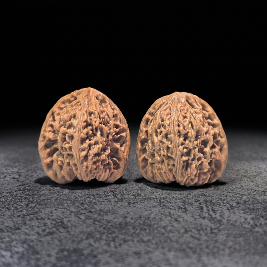Walnut hand exerciser pair, Triangle Nan Jiang Shi model, 39mm x 37mm, handcrafted wooden grip for strength training.