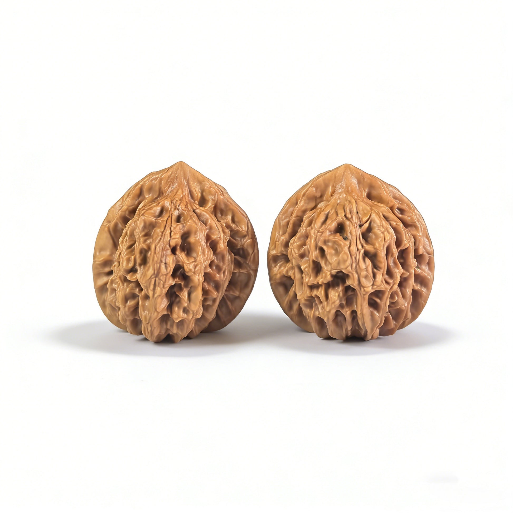 Pair of Walnut Hand Exerciser "Vintage Pinggu" Lion Head design by ThePatinaProject, showing detailed lion head carvings on the walnut handles.