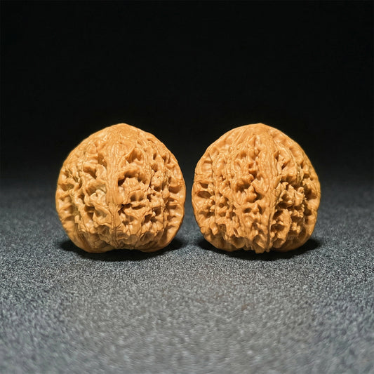 Pair of Walnut Water Dragon hand exercisers by ThePatinaProject, boutique grade, 43mm x 42mm, featuring intricate dragon designs.