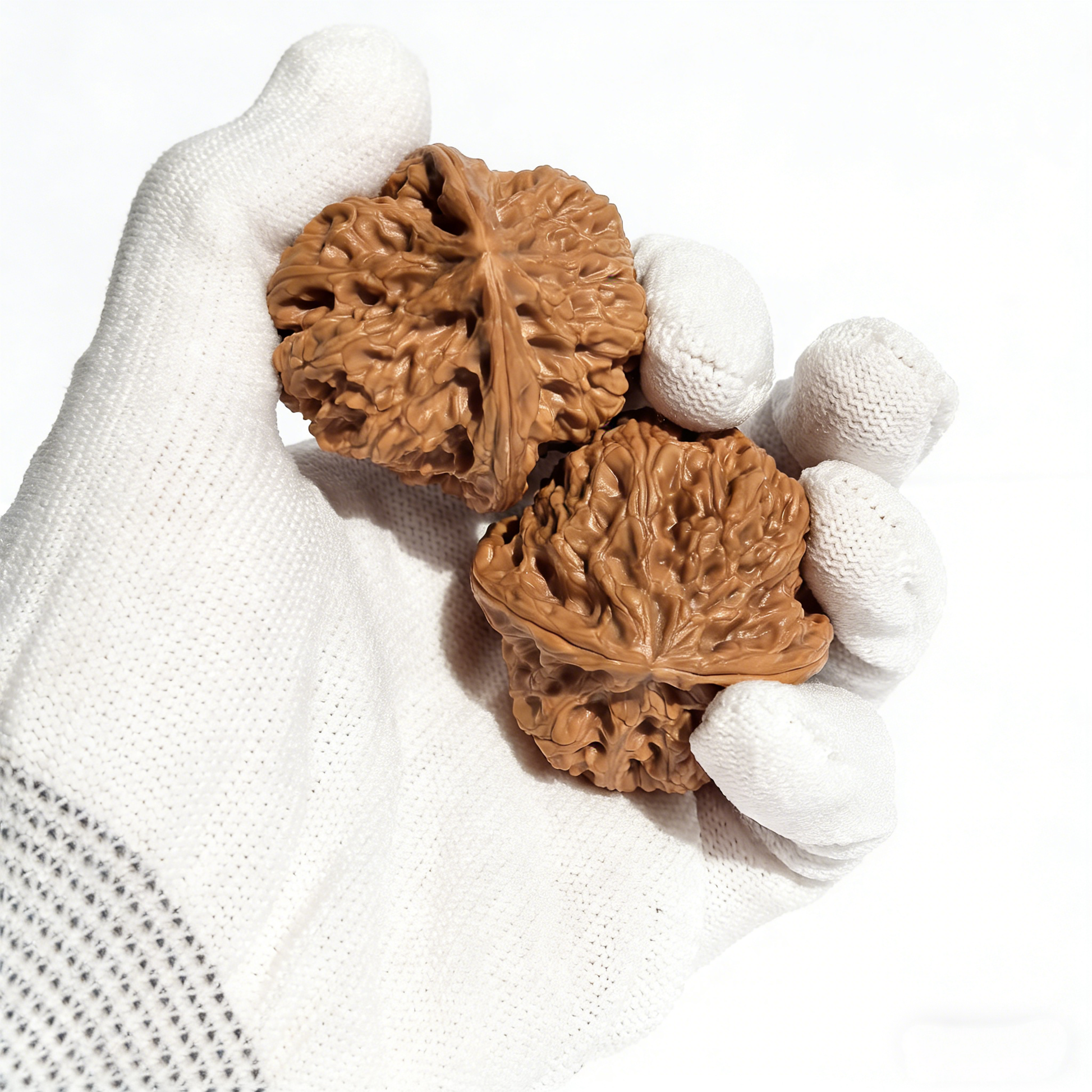 Pair of ThePatinaProject Wild Donkey-Roll walnut hand exercisers with natural textured surface, 41mm collector’s size, for grip strength.