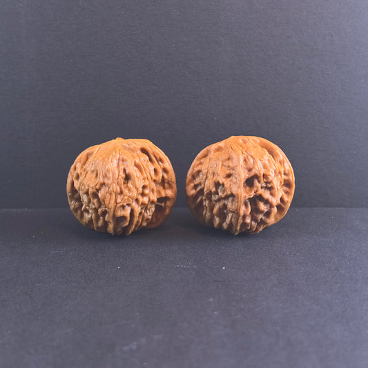 Walnut hand exerciser pair called Wild Millstone by ThePatinaProject, high-density 39mm compact Mo Pan for grip strength training