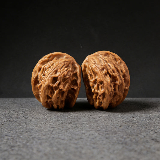 Pair of Walnut Hand Exercisers, Wild Wolf Half-Wall Yelang Banbi, 38mm, by ThePatinaProject, shown with textured wood grain.