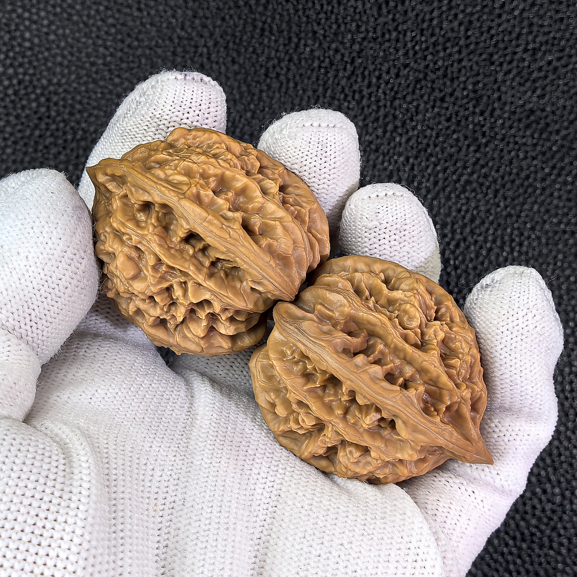Walnut hand exercisers featuring lion head design, Xia Yun Ling pair, 40mm x 37mm, by ThePatinaProject.