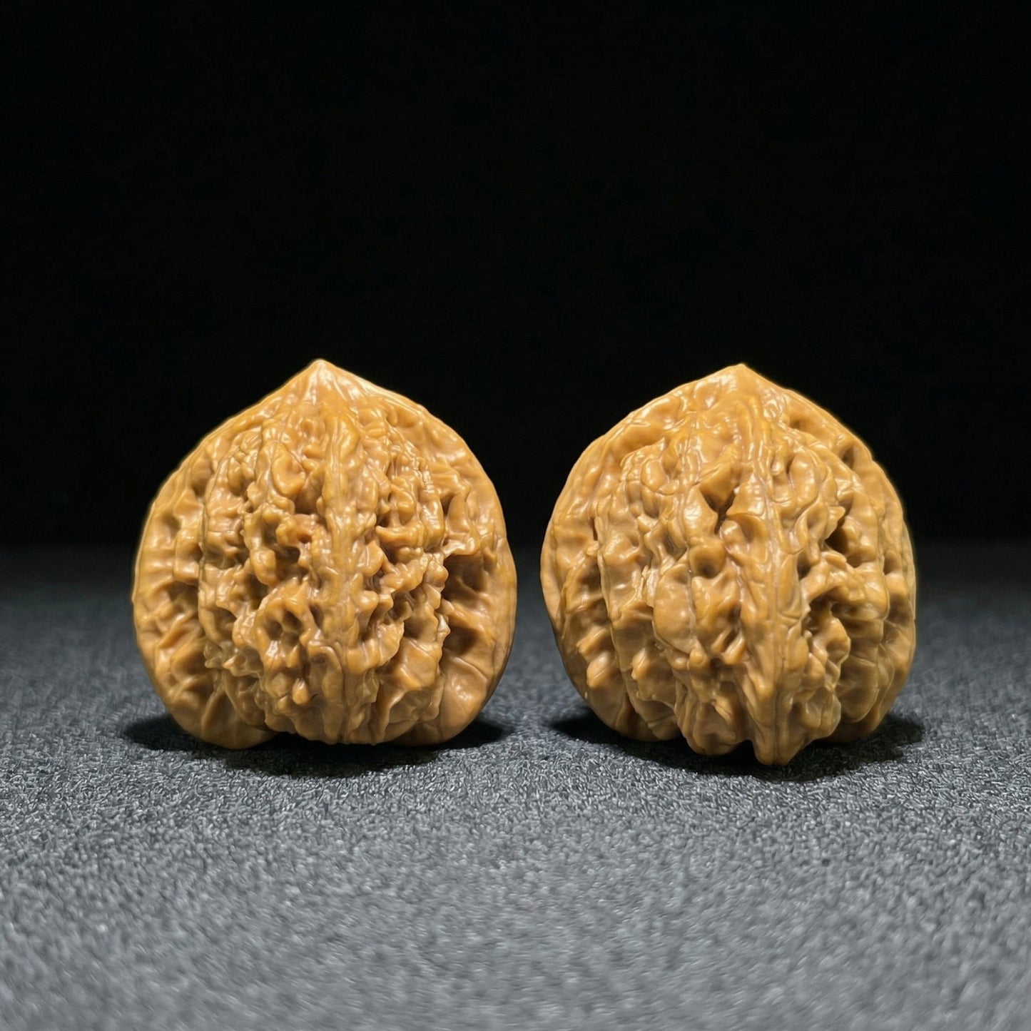 ThePatinaProject Xia Yun Ling Peach Heart Walnut Hand Exerciser pair, 39mm x 36mm, in natural wood finish.