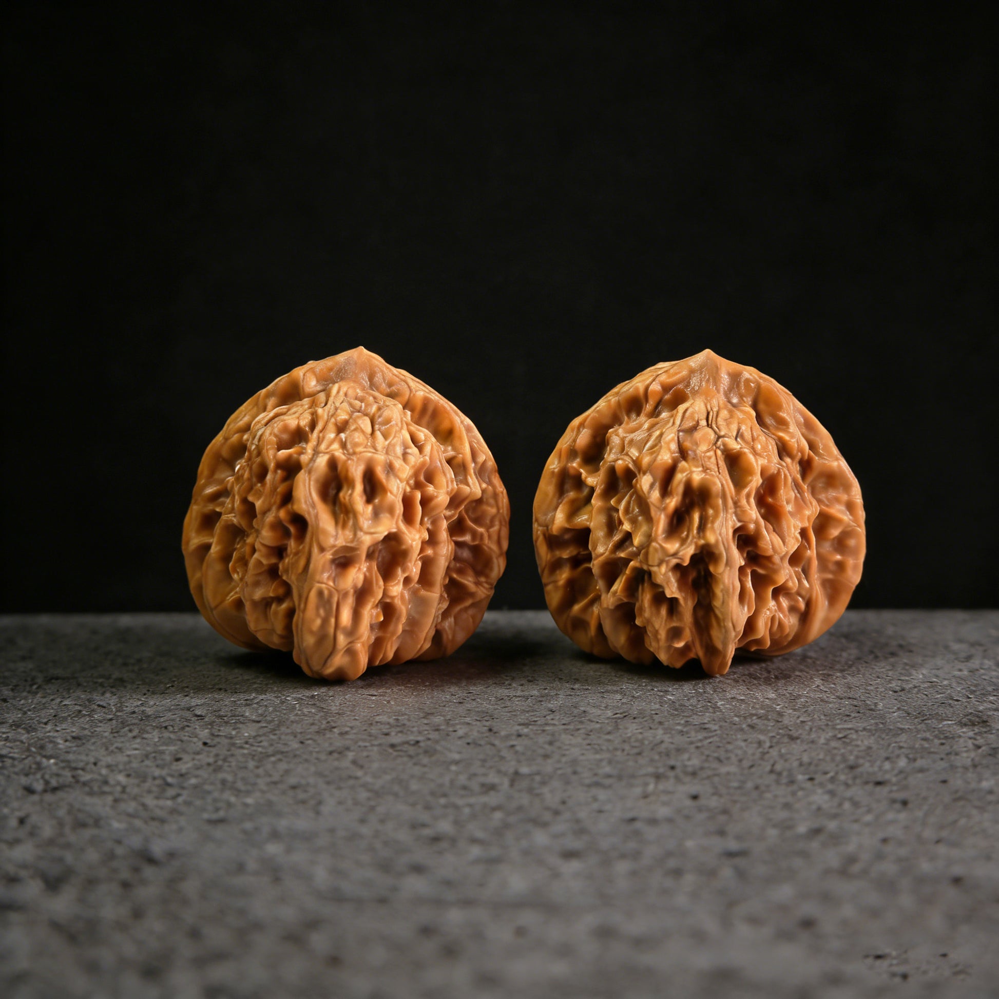Pair of Xia Yun Ling Walnut Hand Exercisers by ThePatinaProject, measuring 42mm x 41mm, with smooth wooden handles and intricate grain.