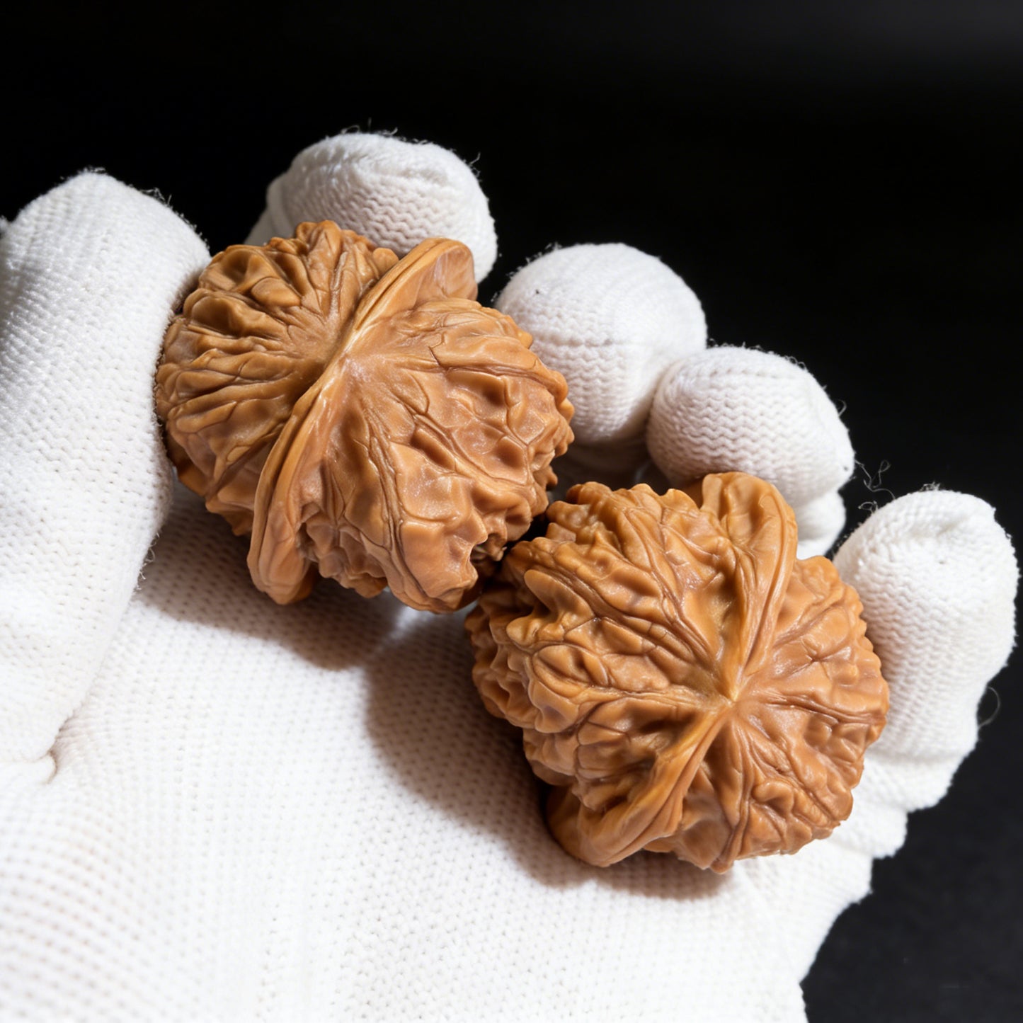 Pair of Xinglong Shaozi walnut hand exercisers, 35mm diameter, from ThePatinaProject, designed for grip strengthening and hand therapy.