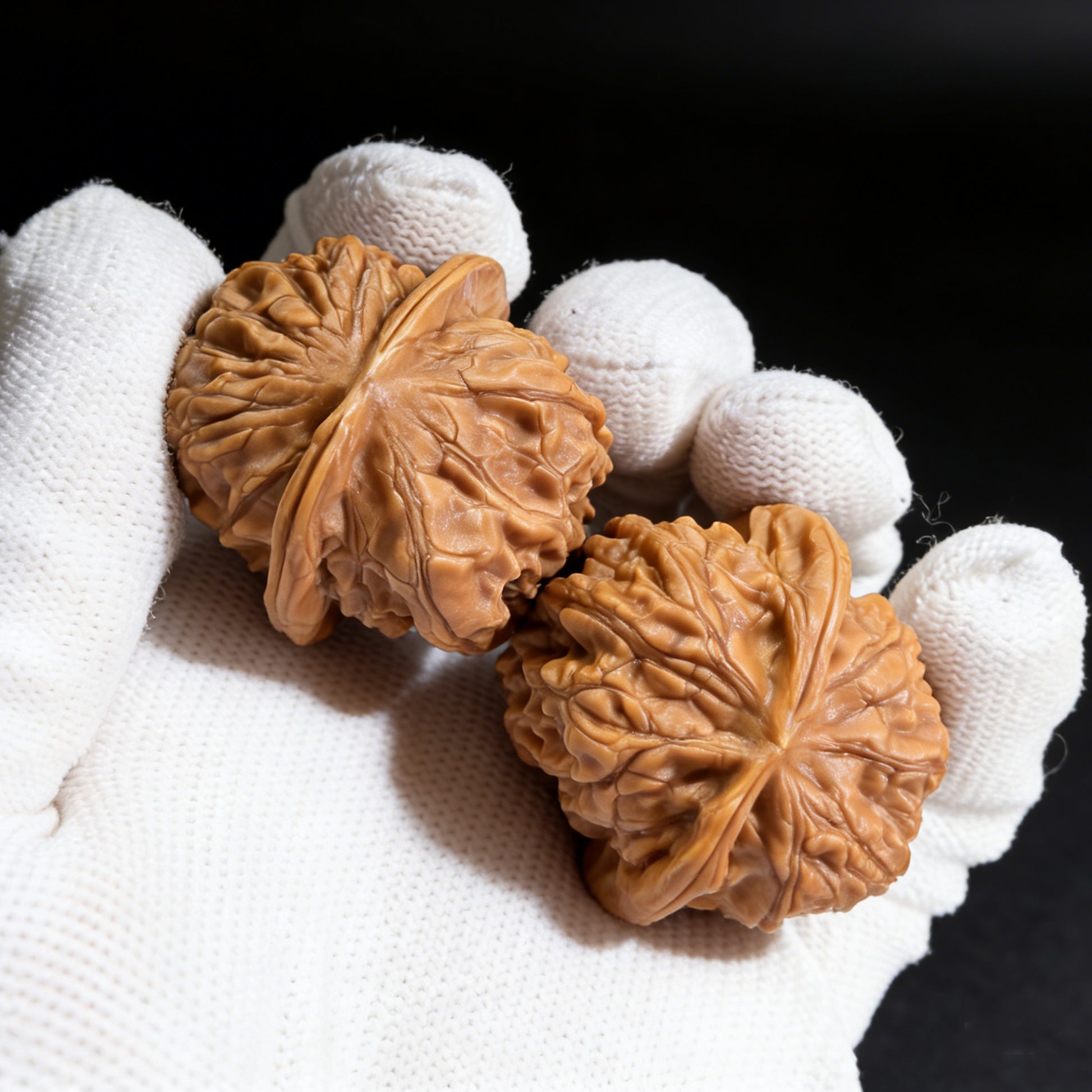 Pair of Xinglong Shaozi walnut hand exercisers, 35mm diameter, from ThePatinaProject, designed for grip strengthening and hand therapy.