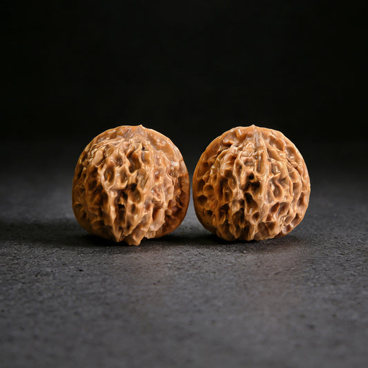 Walnut hand exercisers named "Young Master Qin" by ThePatinaProject, 36mm x 34mm, showing textured wooden grips.