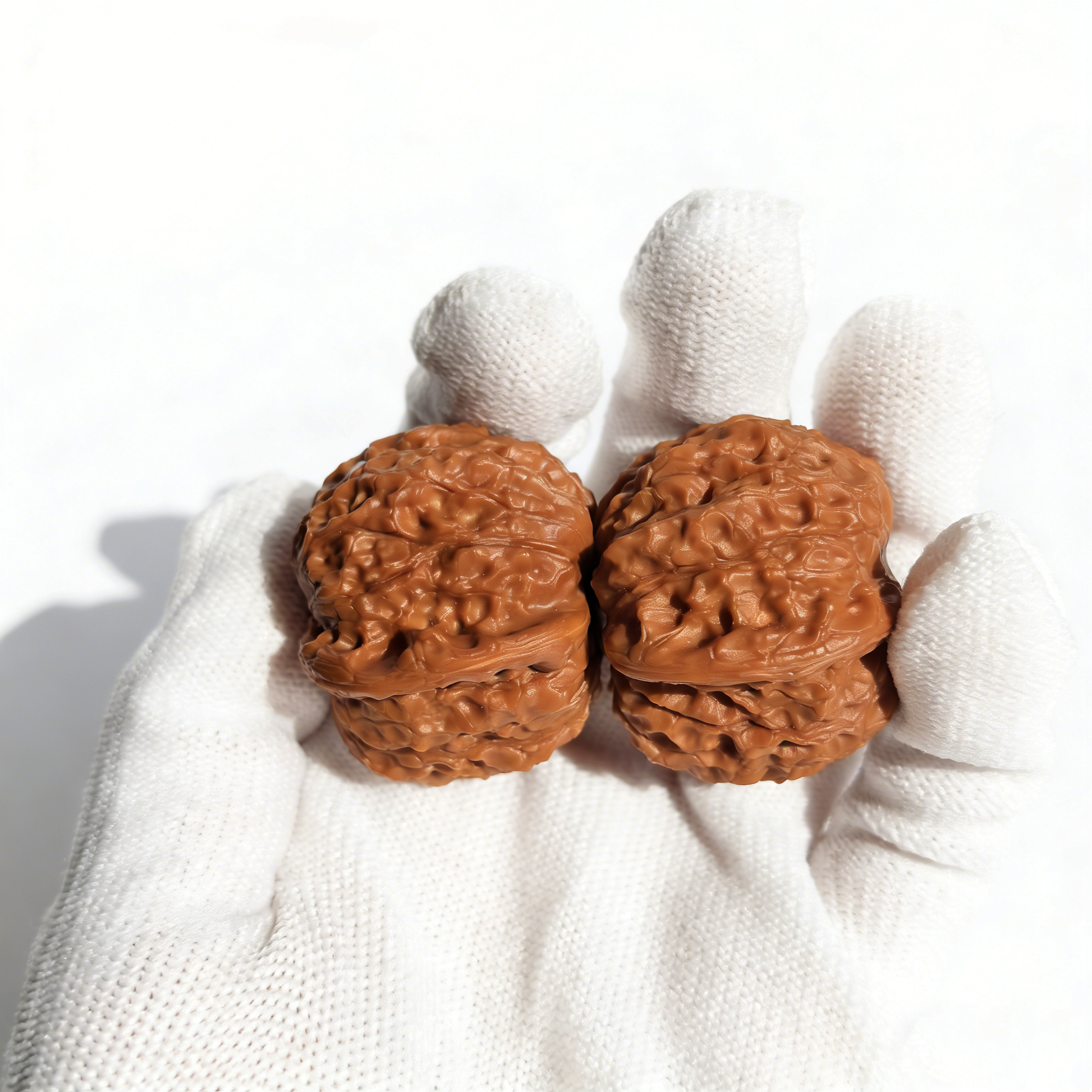 Hand-selected Blood Kirin collector’s Walnut Hand Exerciser from ThePatinaProject, featuring intricate natural wood grain details.