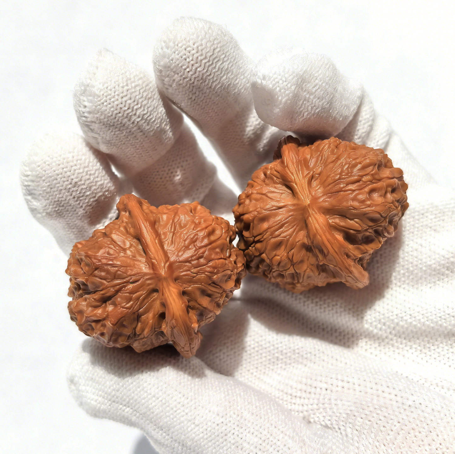 Unique Blood Kirin collector’s Wenwan walnuts by ThePatinaProject, hand-selected walnut hand exercisers with intricate natural patterns.