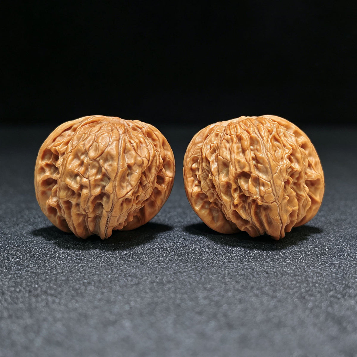 "Wild Millstone Angel Wings" Ye Mopan Tianshi Zhiyi Wenwan Walnuts (Pair) | 40.0mm x 40.0mm | Stock ID: YMPTSZY-1401 - ThePatinaProject