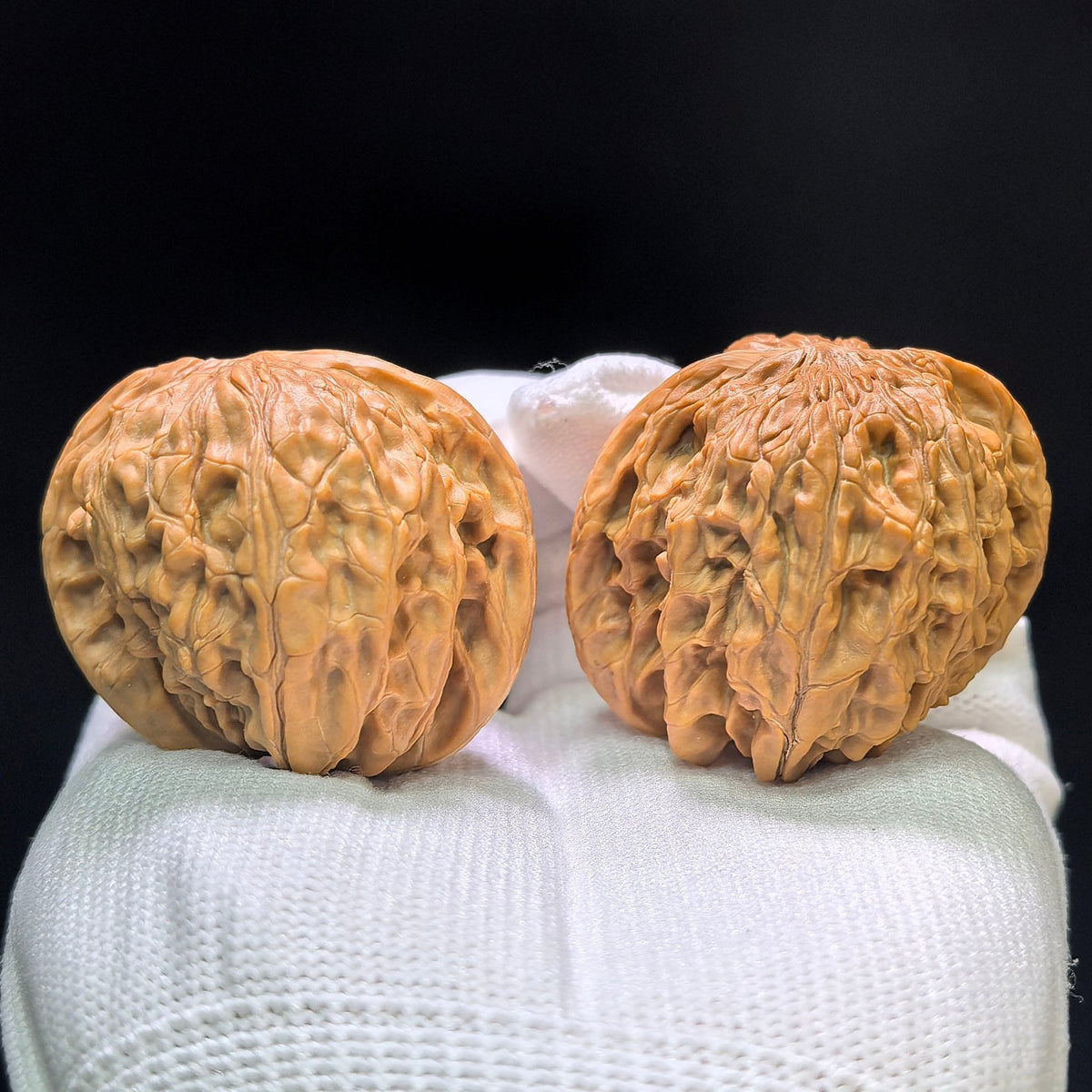 "Wild Millstone Angel Wings" Ye Mopan Tianshi Zhiyi Wenwan Walnuts (Pair) | 40.0mm x 40.0mm | Stock ID: YMPTSZY-1401 - ThePatinaProject