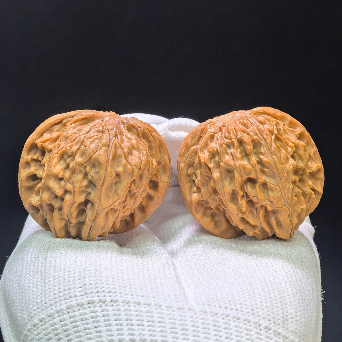 "Wild Millstone Angel Wings" Ye Mopan Tianshi Zhiyi Wenwan Walnuts (Pair) | 40.0mm x 40.0mm | Stock ID: YMPTSZY-1401 - ThePatinaProject